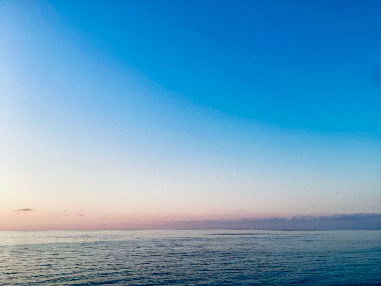 Calm sea under a clear evening sky