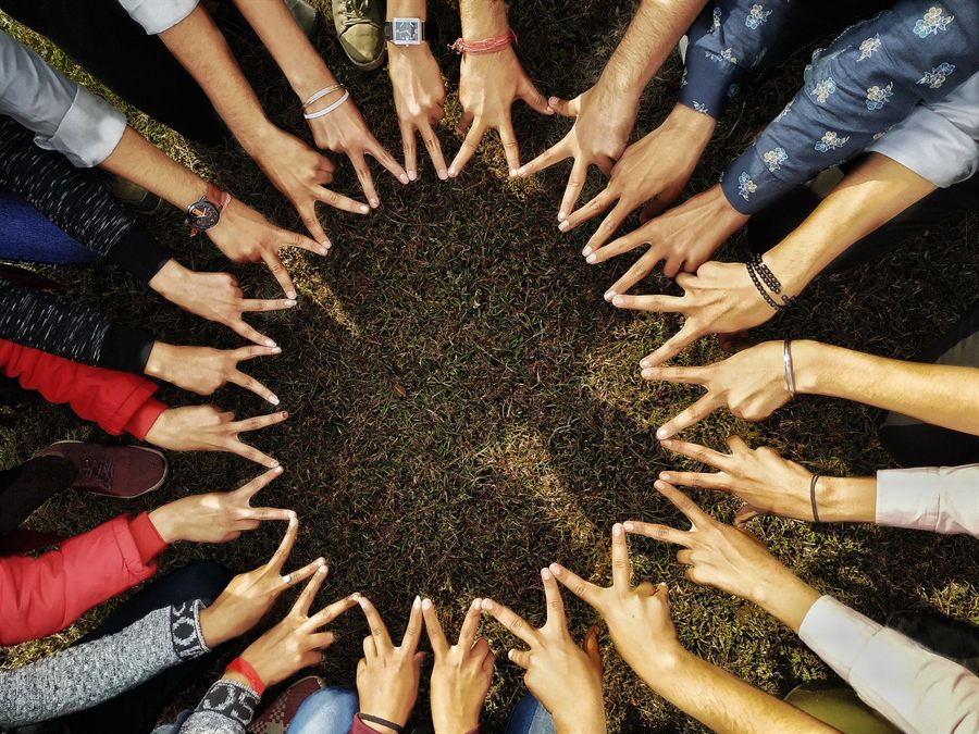 Circle of hands joined together in support