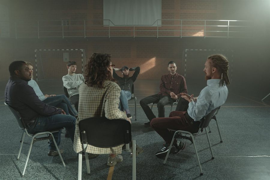 Small group sitting in a circle talking